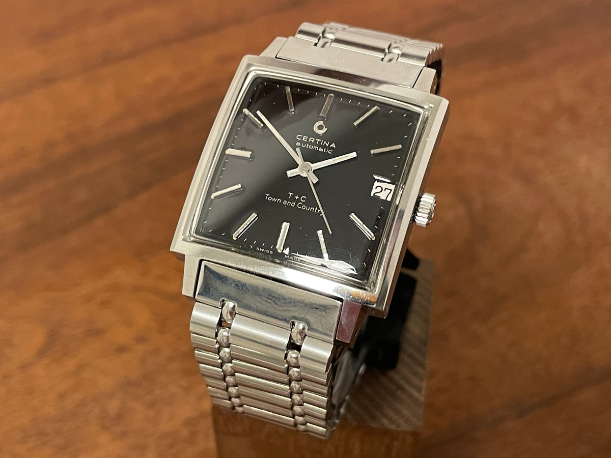 Front side (1960s) Certina 5301.115 Town & Country - bracelet - square case - black dial w/ silver markers (NOS)