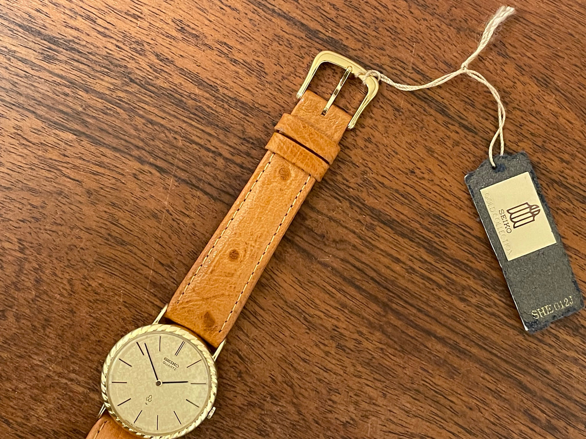 (1977) Seiko 43-0150 14K solid gold dress watch - rope bezel -  gold textured dial w/ gold markers