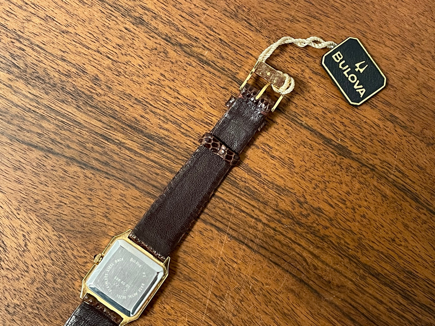 (1982) Bulova Longchamp "Tank" dress watch - gold case w/ champagne dial - small size (NOS)