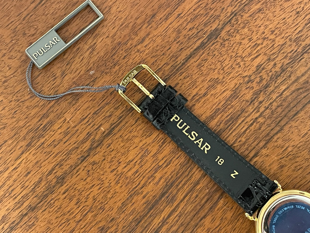 (1999) Pulsar V339-6000 world Timer - gold case - rotating white dial w/ gold markers (NOS)