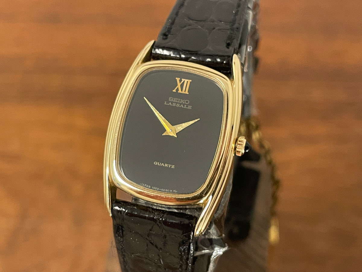 (1980) Seiko 1400-7249 Lassale "Ellipse" dress watch - black dial w/ gold Roman numerals - small size (NOS)