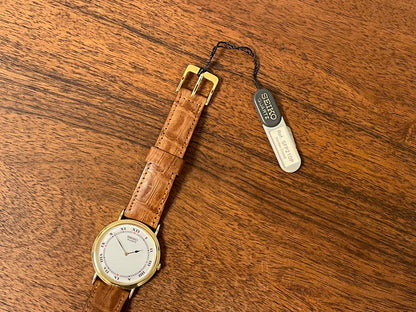 (1992) Seiko 7N00-6A00 dress watch - white dial w/ Roman numerals & Spade hands (NOS)
