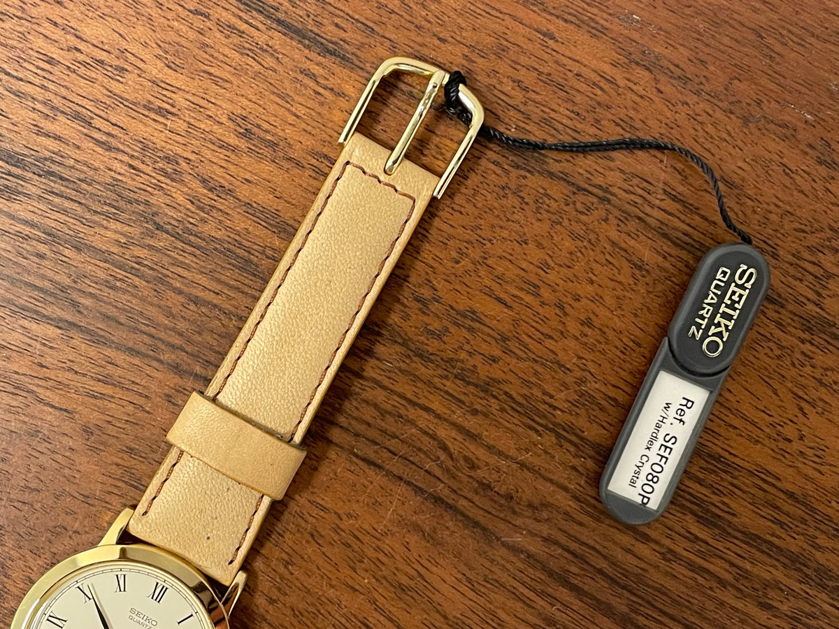 (1989) Seiko 5Y94-8000 dress watch - gold case - cream dial w/ black Roman numerals (NOS)