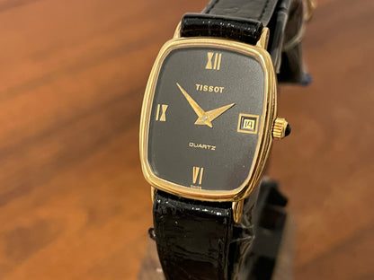 (1980s) Tissot 642.33500/5 Stylist "Ellipse" dress watch - gold case - black dial w/ Roman numerals - small size (NOS)