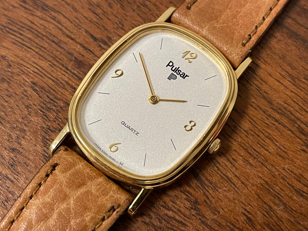 (1985) Pulsar V320-5029 "Ellipse" dress watch - gold case - diamond dust dial (NOS)