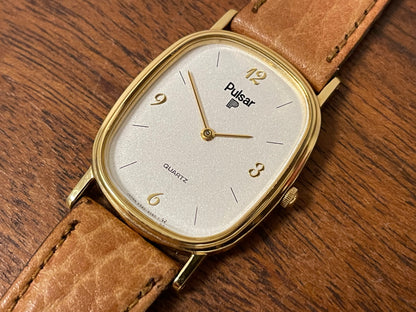 (1985) Pulsar V320-5029 "Ellipse" dress watch - gold case - diamond dust dial (NOS)