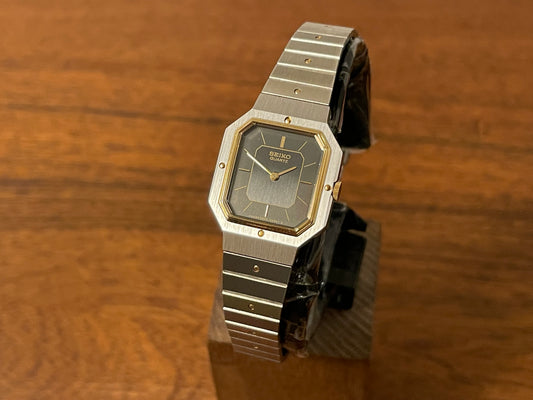 Front side (1982) Seiko 2320-6850 - octagon case - dark grey & black dial w/ gold stick markers - small size (NOS)