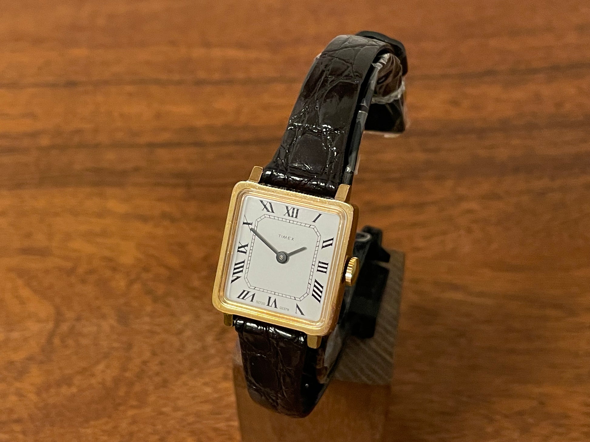 Front side (1970s) Timex 527-201 "Tank" dress watch - gold case - white dial w/ Roman numerals - small size (NOS + Full set)