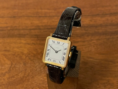 Front side (1970s) Timex 527-201 "Tank" dress watch - gold case - white dial w/ Roman numerals - small size (NOS + Full set)