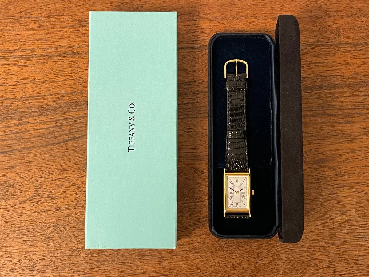 (1998) Tiffany & Co. Portfolio "Tank" dress watch - gold case - white dial w/ black Roman numerals (Mint)