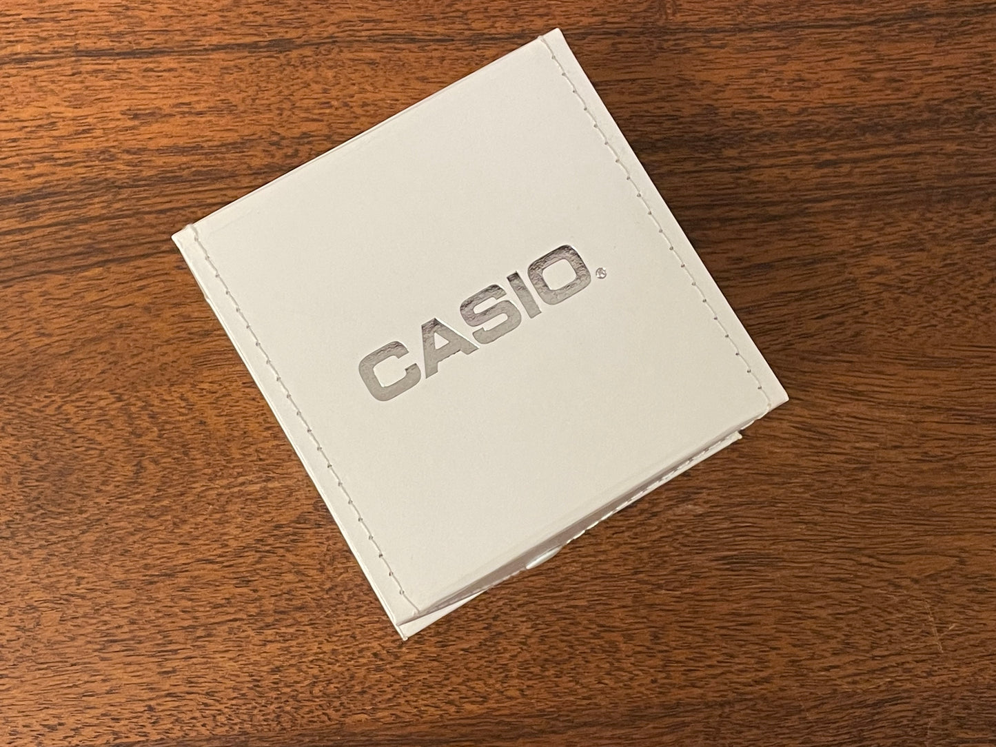 Casio watch box - white w/ fold-over lid and snap button closure
