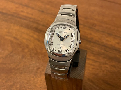 Front side Seiko 7N89-0AA0 Premier on bracelet- white dial w/ Arabic numerals