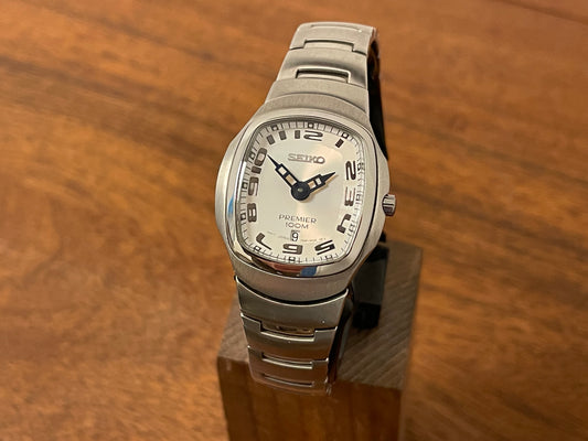 Front side Seiko 7N89-0AA0 Premier on bracelet- white dial w/ Arabic numerals