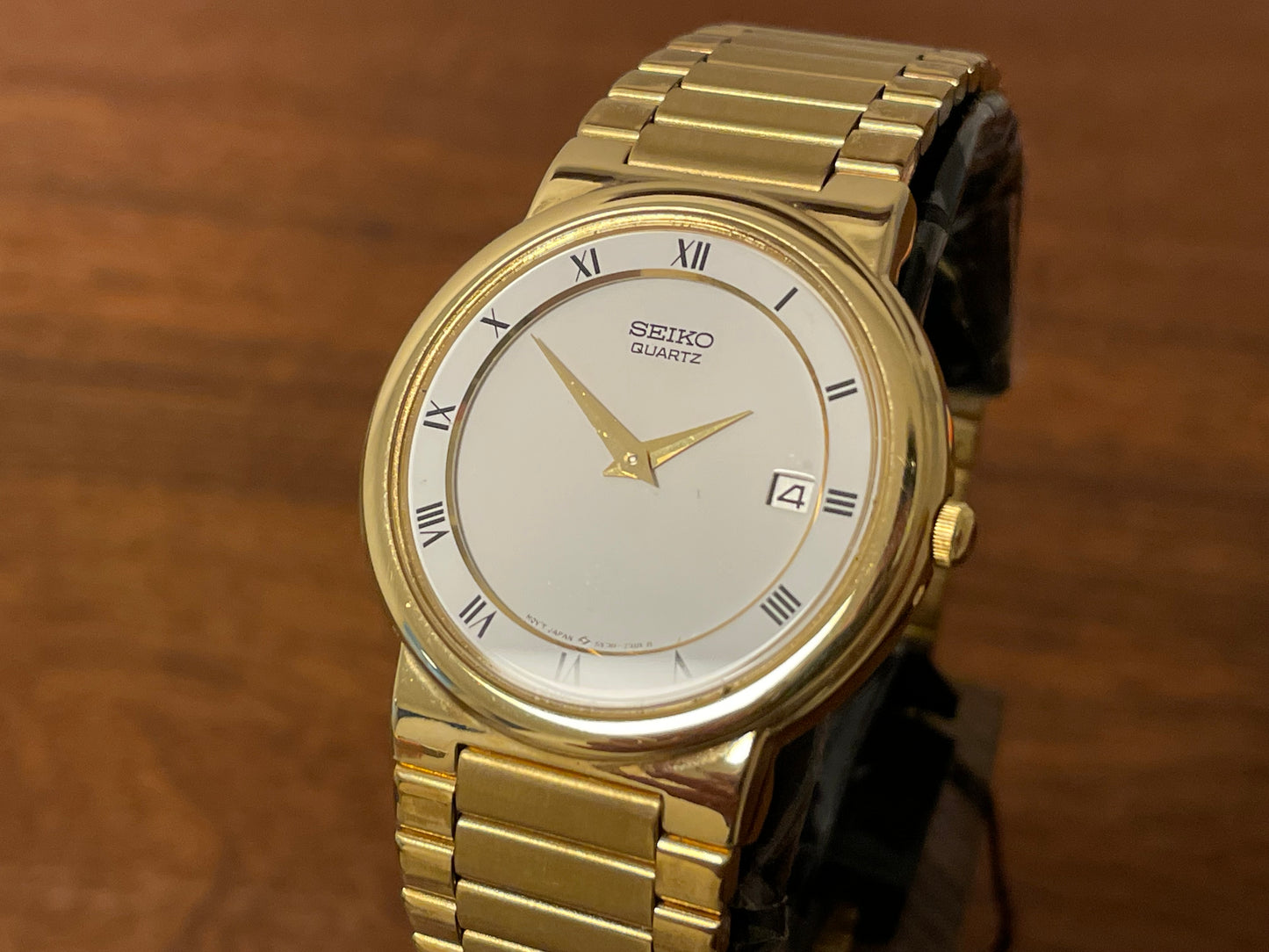 (1992) Seiko 5Y89-7A10 dress watch – white dial w/ Roman numerals & date (NOS)