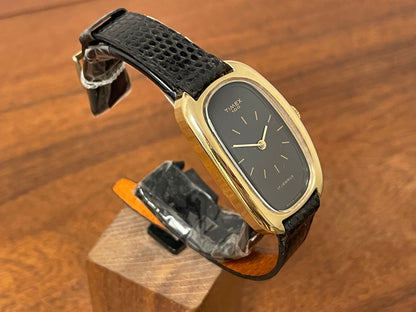 (1979) Timex 100 manual wind dress watch - Swiss made - tonneau case - black dial w/ gold markers