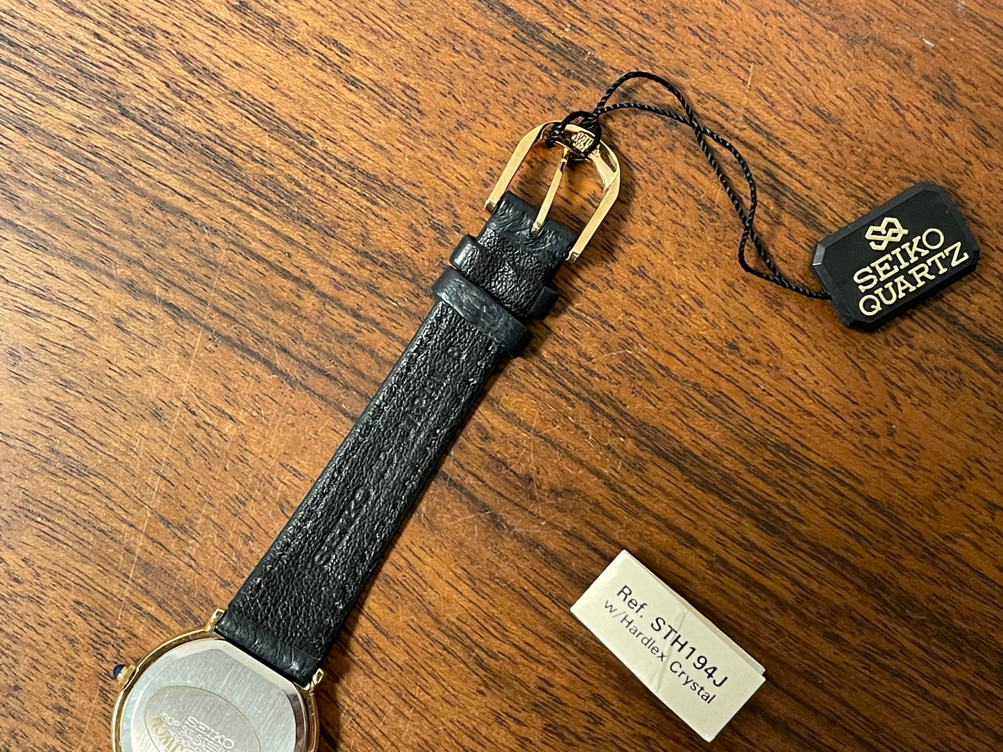 (1983) Seiko 7320-010A dress watch - purple bezel - dark blue dial w/gold markers - small size (NOS)