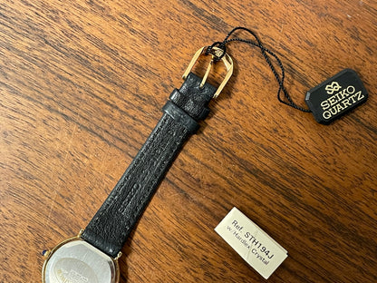 (1983) Seiko 7320-010A dress watch - purple bezel - dark blue dial w/gold markers - small size (NOS)