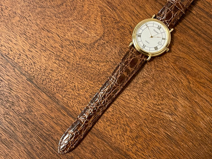 (2000) Pulsar V532-8A60 dress watch - gold colored case - white dial w/ black Roman numerals (NOS)