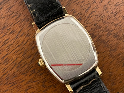 (1980s) Tissot 642.33500/5 Stylist "Ellipse" dress watch - gold case - black dial w/ Roman numerals - small size (NOS)