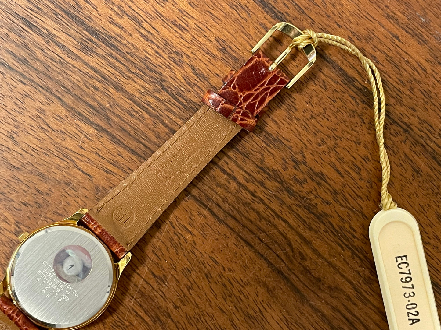 (1981) Citizen 6031-S38419 dress watch - white dial w/ gold Roman numerals - small size (NOS)