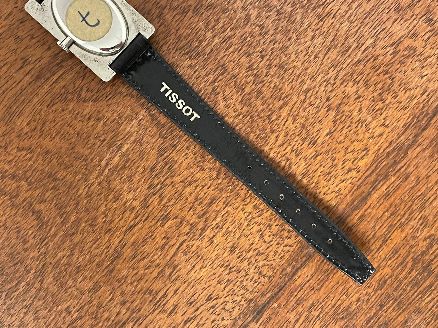 (1970s) Tissot Stylist "Tank" - decorated case - black sunburst dial w/ white Roman numerals - small size (NOS)