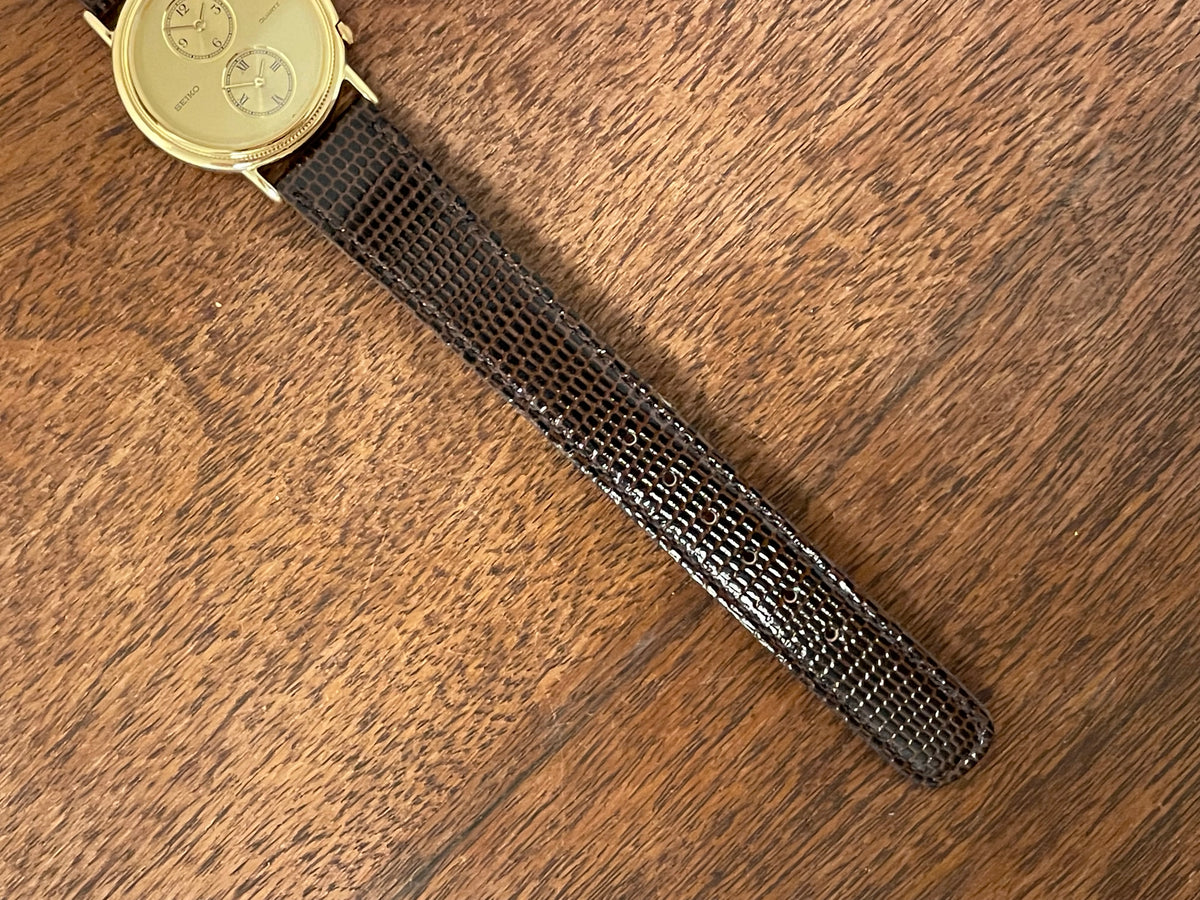 (1985) Seiko 1E20-0160 dual time dress watch - round case - gold textured dial w/ 2 subdials