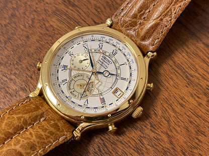 (1994) Seiko 6m13-0010 Age of Discovery (AOD) Perpetual Calendar - gold colored case - white dial w/ black Roman numerals