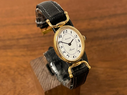 (1980s/1990s) Bulova Paris dress watch - oval case - cream dial w/ black Arabic numerals - small size (NOS)