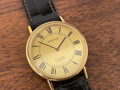 (1970s) Tissot 40771 Stylist dress watch - gold case - brushed gold dial w/ black Roman numerals (NOS)