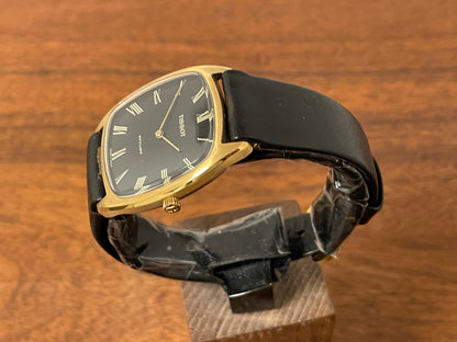 (1970s) Tissot Stylist dress watch - gold case - black dial w/ gold Roman numerals (NOS)