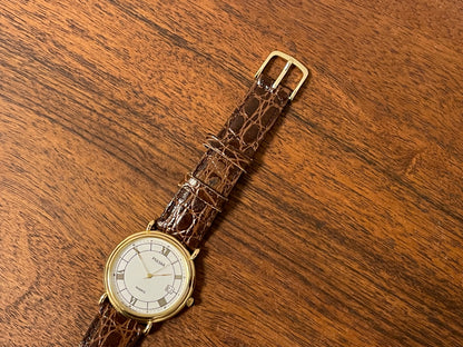 (2000) Pulsar V532-8A60 dress watch - gold colored case - white dial w/ black Roman numerals (NOS)