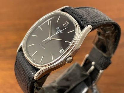 (1982) Pulsar Y112-5099 "Ellipse" dress watch - silver case - black dial w/ silver stick markers (NOS)