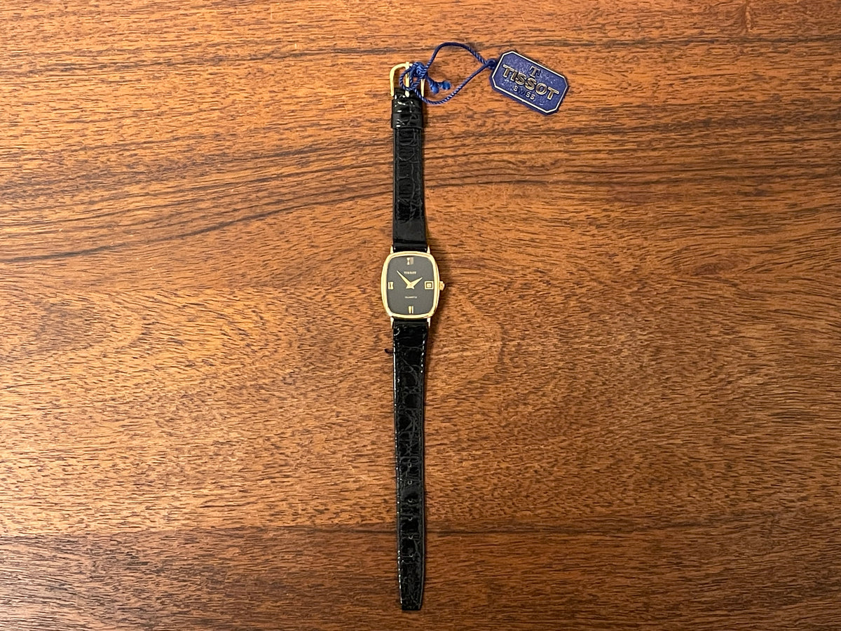(1980s) Tissot 642.33500/5 Stylist "Ellipse" dress watch - gold case - black dial w/ Roman numerals - small size (NOS)