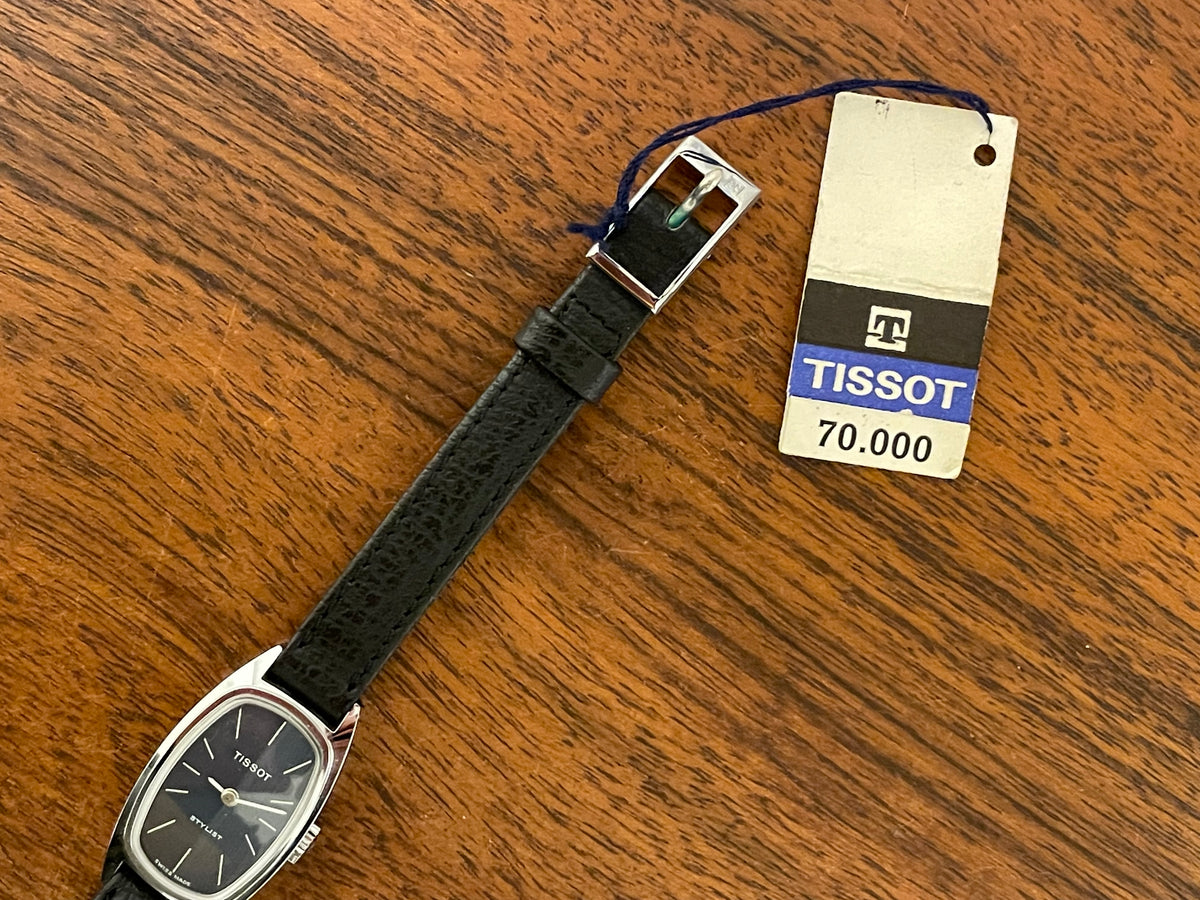 (1970s) Tissot HZ-10720 Stylist dress watch - silver tonneau case - blue brushed dial w/ silver stick markers - small size (NOS)