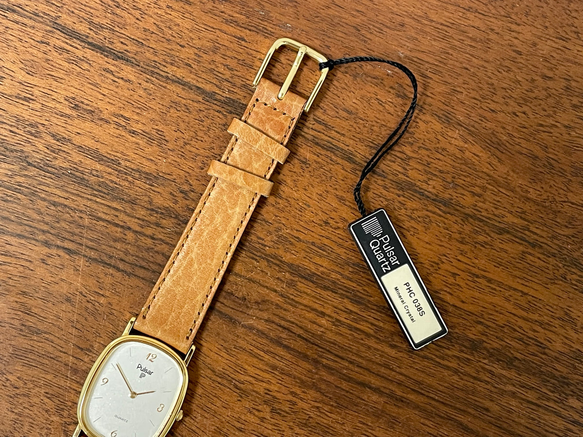 (1985) Pulsar V320-5029 "Ellipse" dress watch - gold case - diamond dust dial (NOS)