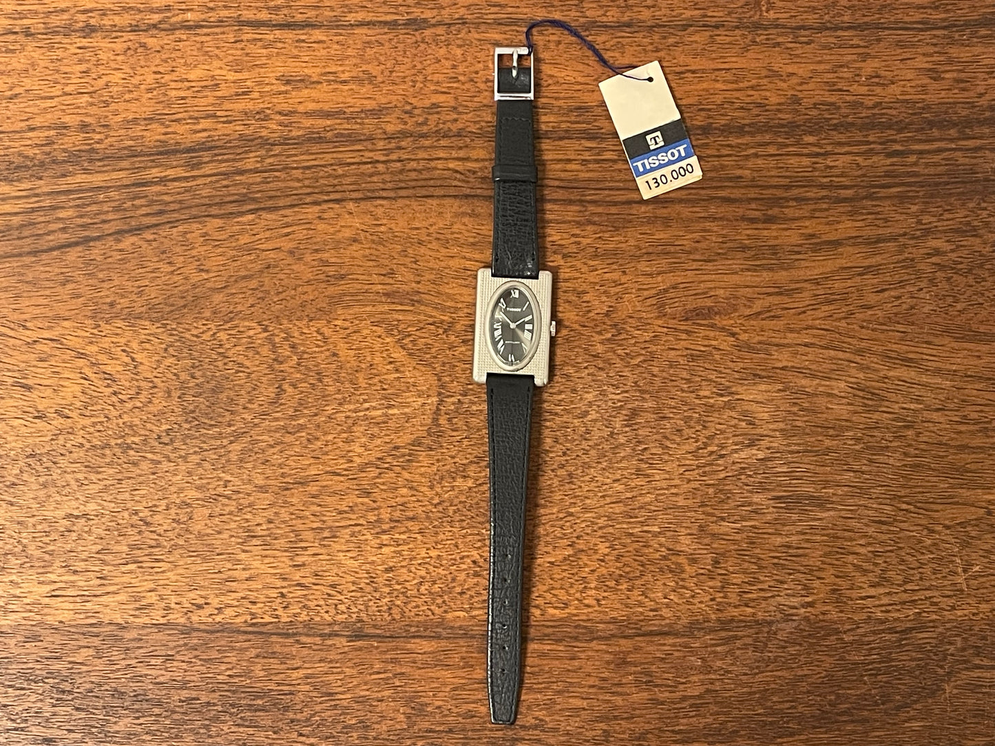 (1970s) Tissot Stylist "Tank" - decorated case - black sunburst dial w/ white Roman numerals - small size (NOS)