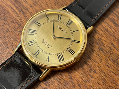 (1970s) Tissot 40771 Stylist dress watch - gold case - brushed gold dial w/ black Roman numerals (NOS)