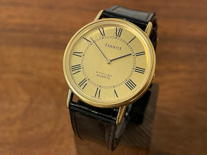 Front side (1970s) Tissot Stylist dress watch - gold case - brushed gold dial w/ black Roman numerals (NOS)
