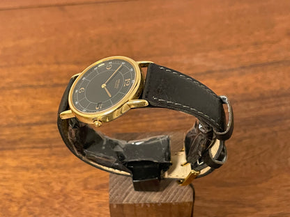 (2000) Seiko 5Y39-7010 dress watch - gold colored case - black dial w/ flat gold Arabic numerals (NOS)