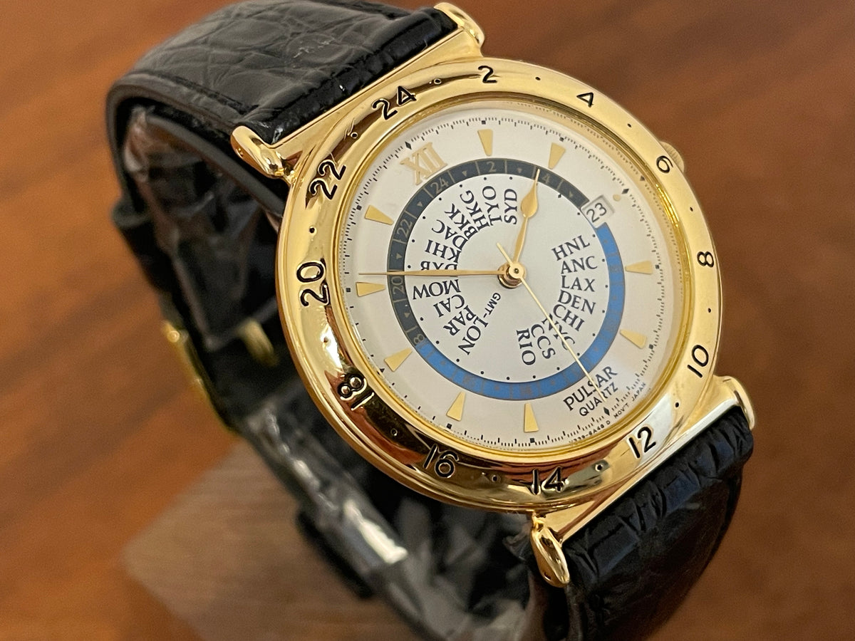 (1999) Pulsar V339-6000 world Timer - gold case - rotating white dial w/ gold markers (NOS)