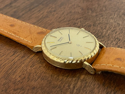 (1977) Seiko 43-0150 14K solid gold dress watch - rope bezel -  gold textured dial w/ gold markers