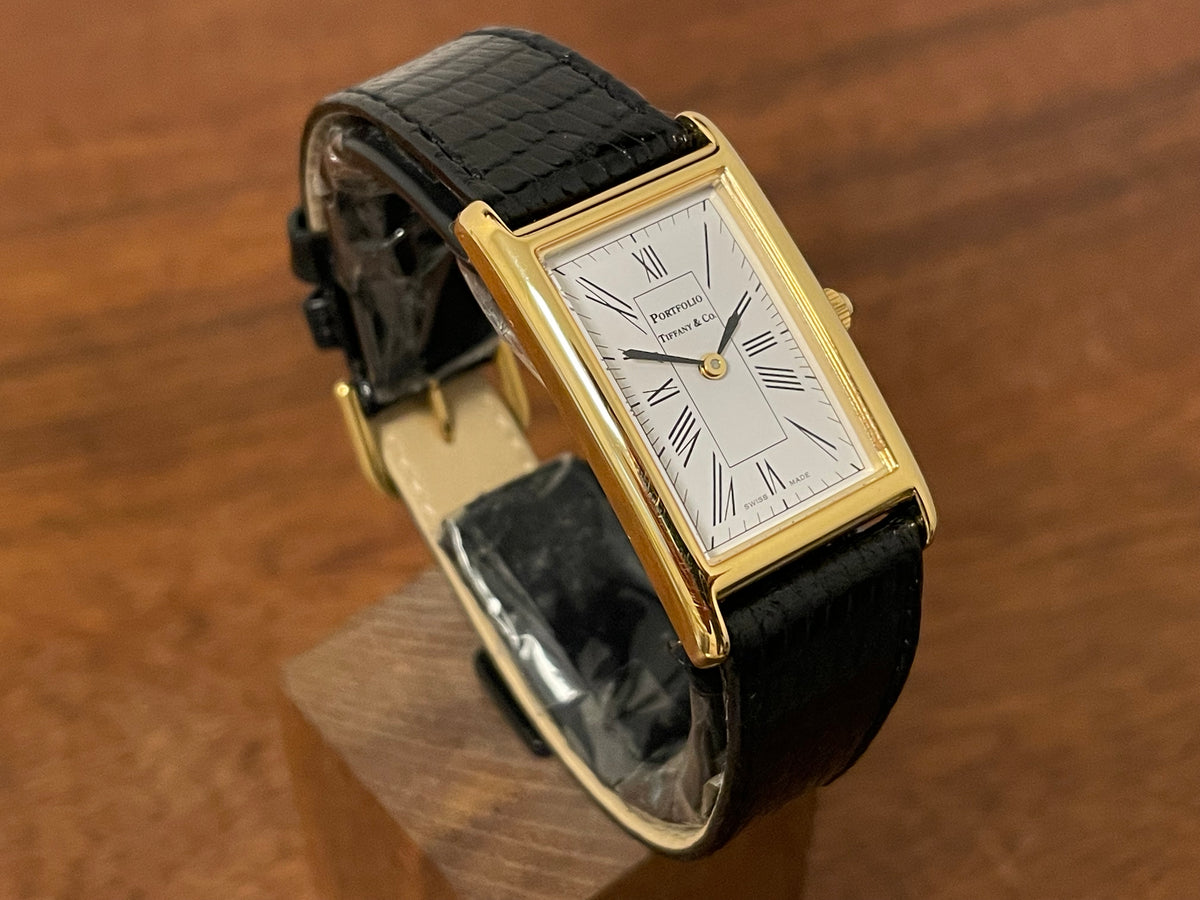 (1998) Tiffany & Co. Portfolio "Tank" dress watch - gold case - white dial w/ black Roman numerals (Mint)