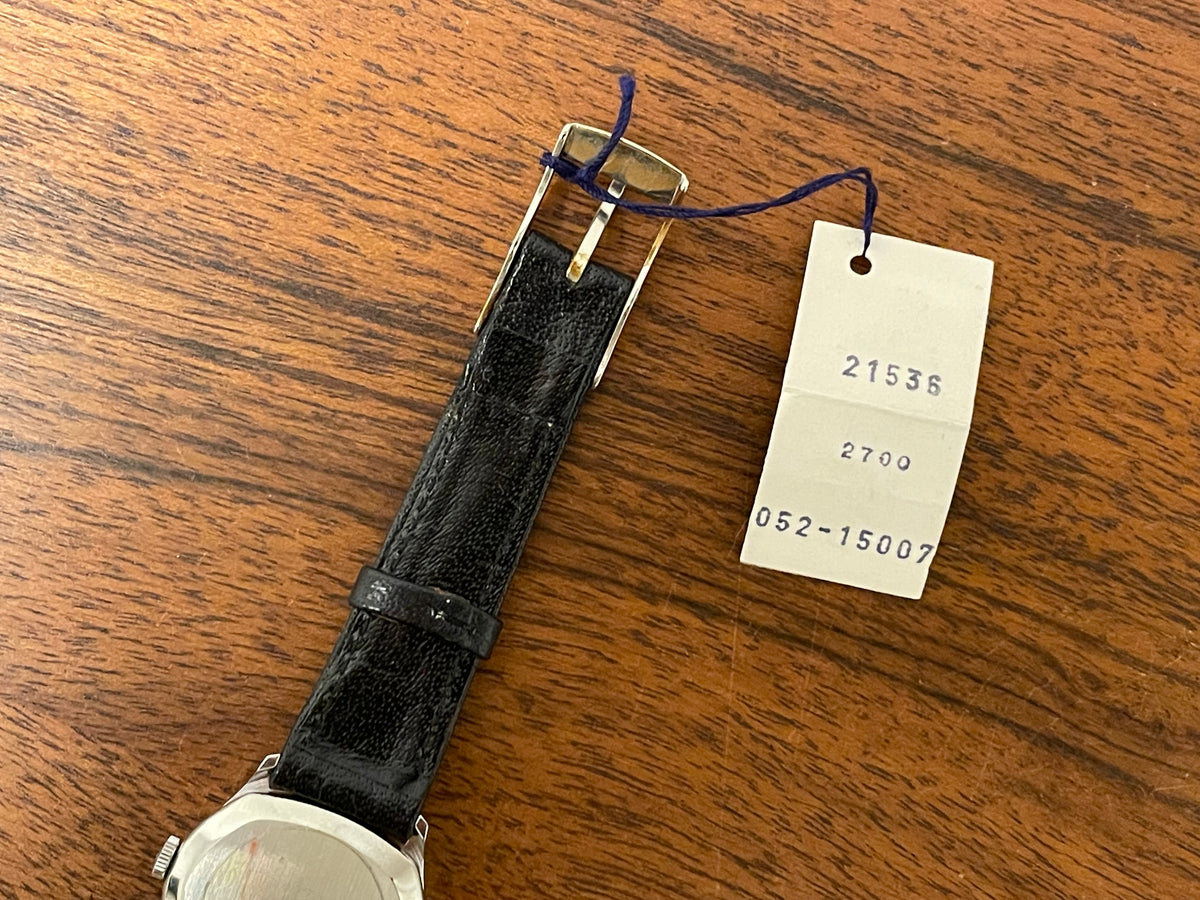 (1970s) Tissot 052-15007 Stylist dress watch - silver cushion case - silver brushed dial w/ silver stick markers - small size (NOS)