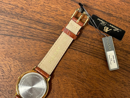 (2003) Pulsar V532-8B40 dress watch - gold colored case - white dial w/ gold markers (NOS)