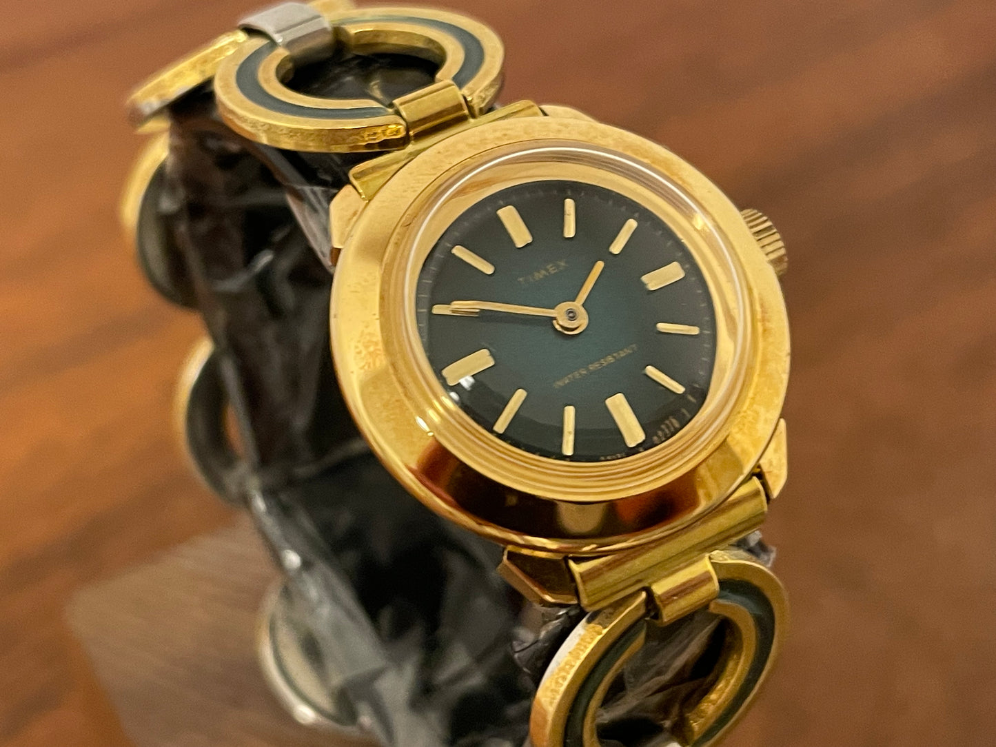 (1970s) Timex 551-211 dress watch - gold case - green dial w/ gold markers - small size (NOS + full set)