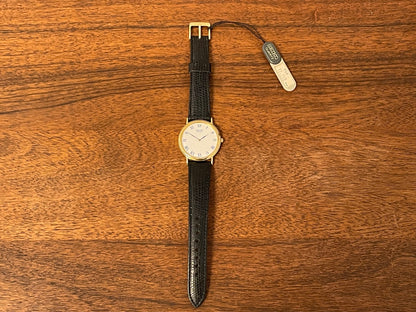 (1991) Seiko 7N00-8A00 dress watch - white dial w/ Roman numerals & Leafe hands (NOS)