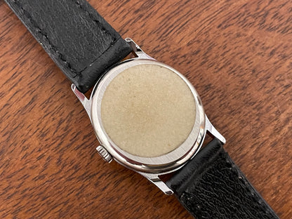 (1970s) Tissot 052-10991 Stylist dress watch - silver oval case - silverdust dial w/ silver stick markers - small size (NOS)