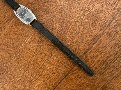 (1970s) Tissot HZ-10720 Stylist dress watch - silver tonneau case - blue brushed dial w/ silver stick markers - small size (NOS)
