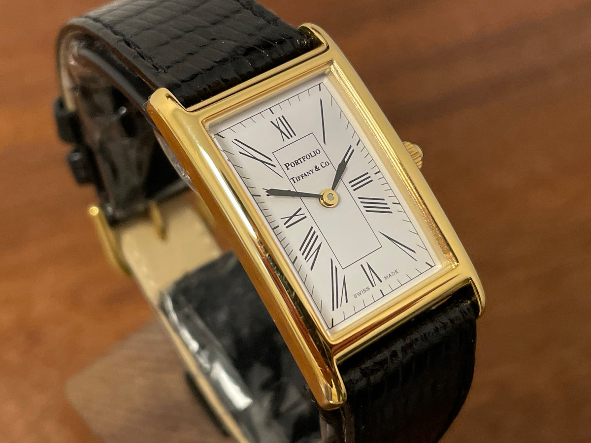 (1998) Tiffany & Co. Portfolio "Tank" dress watch - gold case - white dial w/ black Roman numerals (Mint)