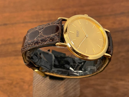 (2004) Seiko 7N00-6A70 dress watch -gold dial w/ gold markers - small size (NOS)